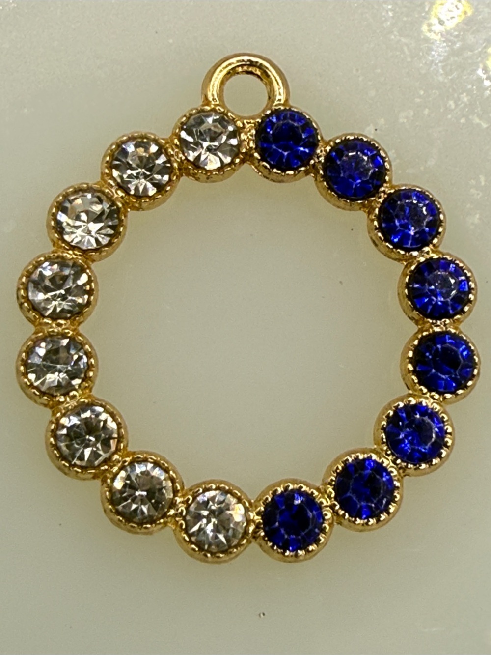 Gold tone Circle Pendant with Blue and Clear rhinestones